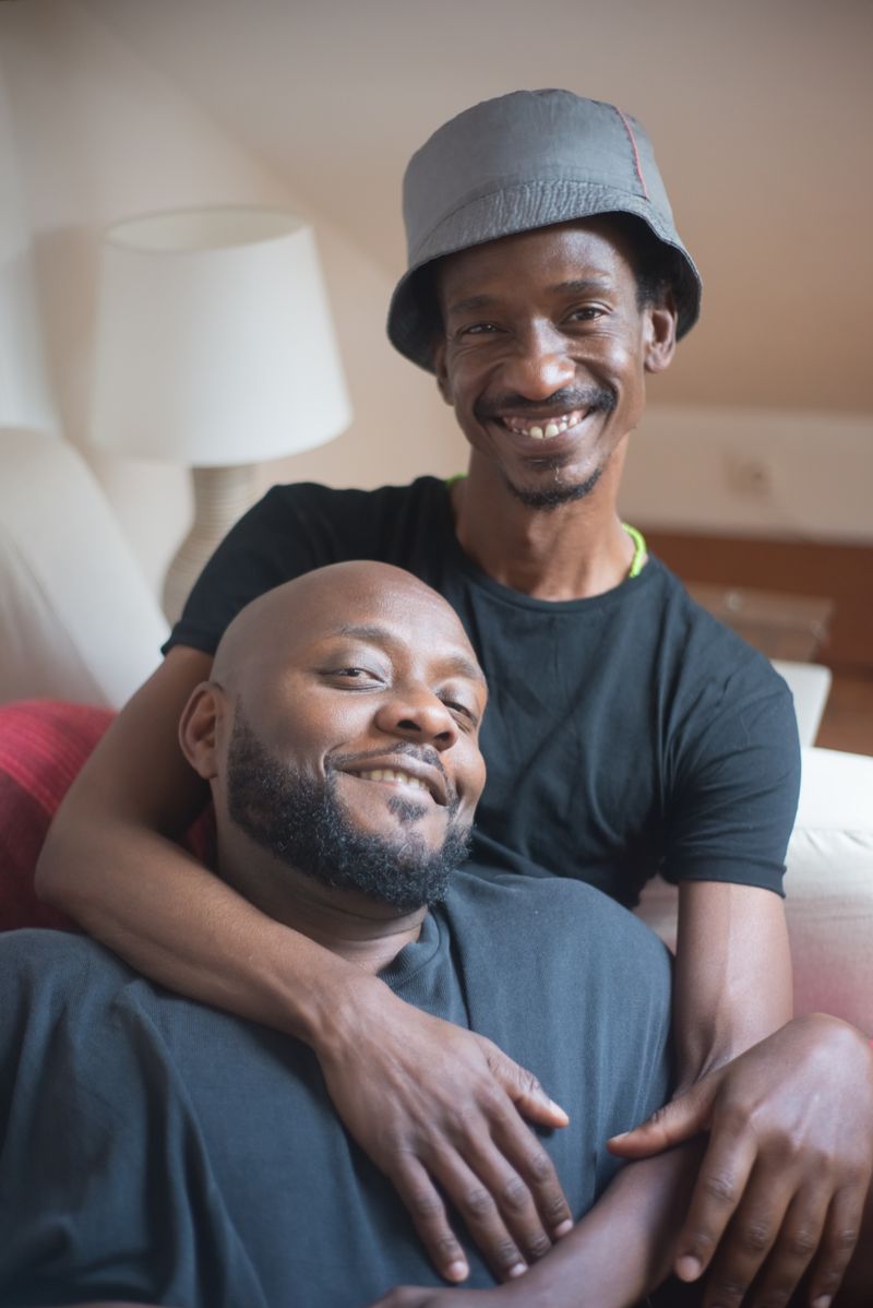 A man smiling, relaxed at home