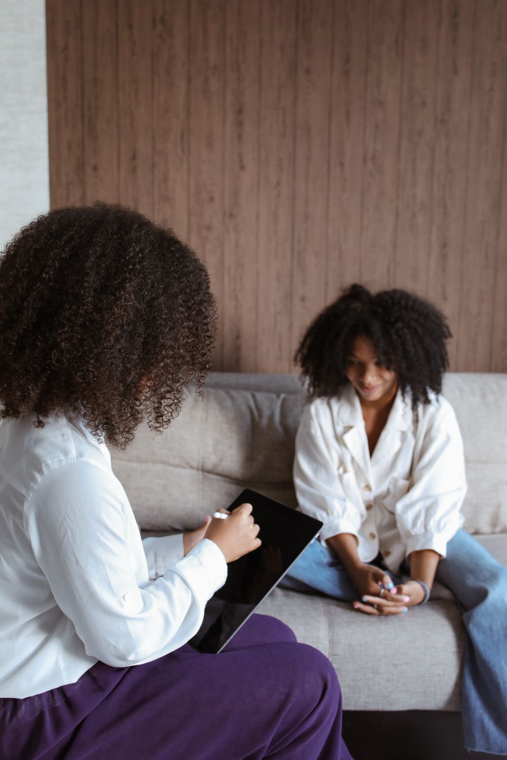 Two women talking during a therapy session